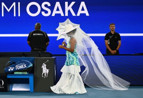 Naomi Osaka of Japan walks onto Rod Laver Arena for her first round match against Antonia Ruzic.