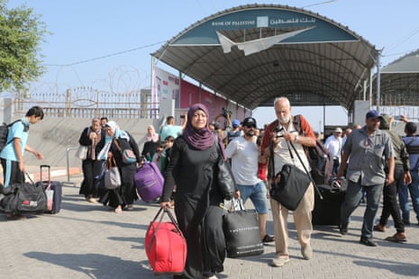 People prepare to leave the Gaza Strip for Egypt via the Rafah crossing.