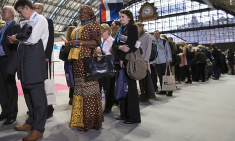 Delegates queue to get into the hall to hear David Cameron’s speech at the Conservative conference.