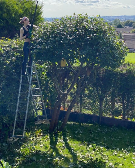 Natacha trimming a tree in summer 2021, a pair of months earlier to she contracted Covid.