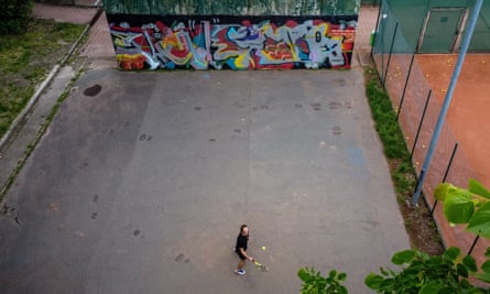 A tennis payer practising solo.