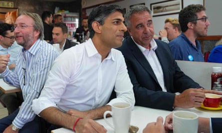 Rishi Sunak sits with newly elected Conservative MP Steve Tuckwell at a cafe in Ruislip.