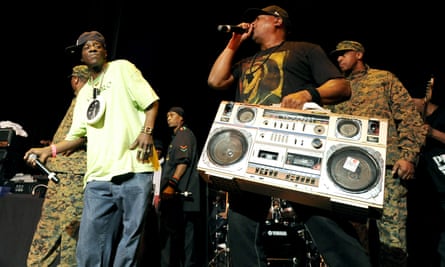 Flavor Flav (left) and Chuck D (with the large boombox) perform at Yoshi’s nightclub in San Francisco in January 2011.