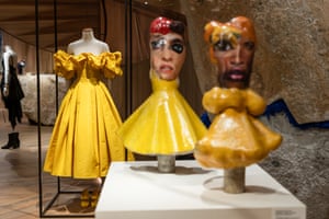 Hand-crafted yellow dresses on papier mache dolls with faces collaged from fashion magazines