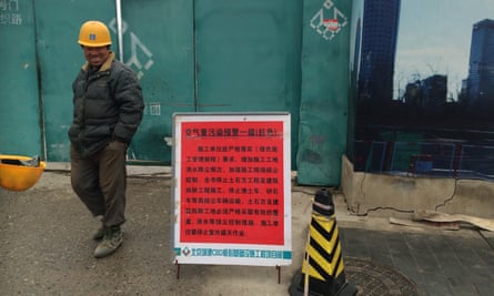 Carpenter Jin Yingtang outside his suspended construction site.