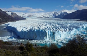 Tourists look at the Perito Moreno glacier