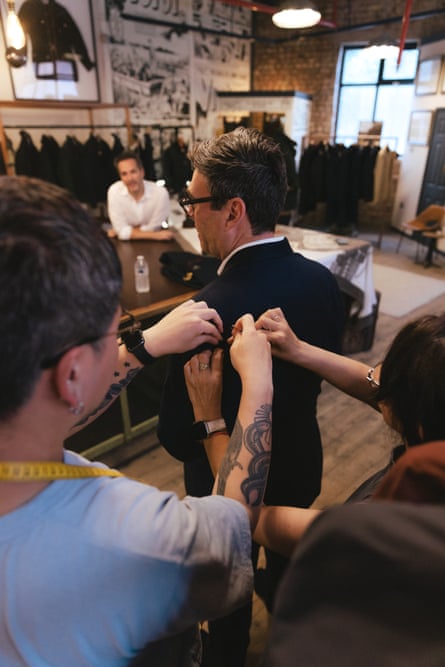 Staff at Private White VC measure the new PM for a jacket