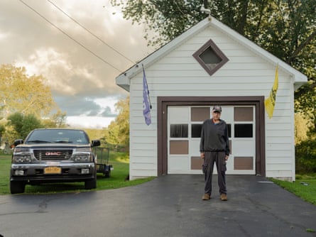 Ed Roth’s home in White Sulphur Springs is bedecked with three large flags in front and two hanging from his detached garage.