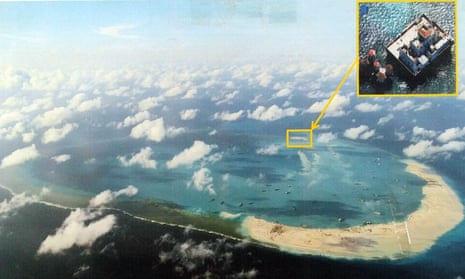 This reproduction photo shows the construction at Mischief Reef in the disputed Spratley Islands in the south China Sea by China on 12 April 2015.