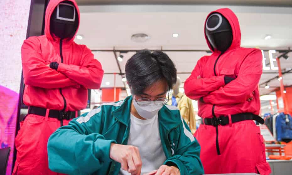 A man participates in a Netflix series Squid Game mission at a store in Bangkok, Thailand. The series is a South Korean survival drama.