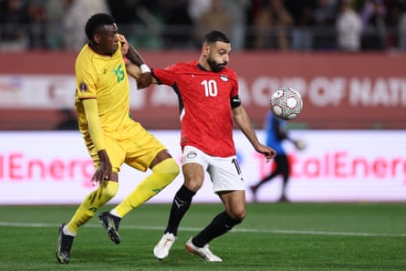 Mohamed Salah vies for possession with Zimbabwe’s Teenage Hadebe during Egypt’s hard-fought Africa Cup of Nations win on Monday night.