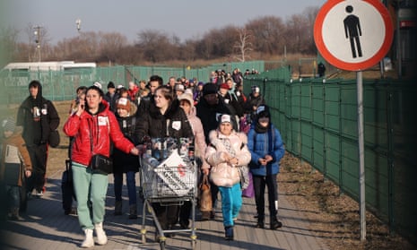 Ukrainian refugees arrive at Medyka border crossing in Poland on 14 March. 