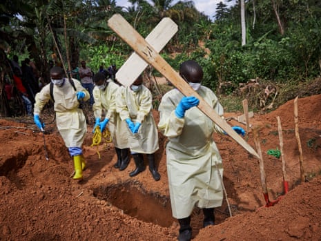 Health workers undertaking the burial of an 11-month-old child, Bunzi, in Beni, North Kivu province, DRC on 5 May 2019.