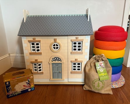 Selection of four gifts for five-year-olds, including multi-coloured stepping stones and a doll’s house.