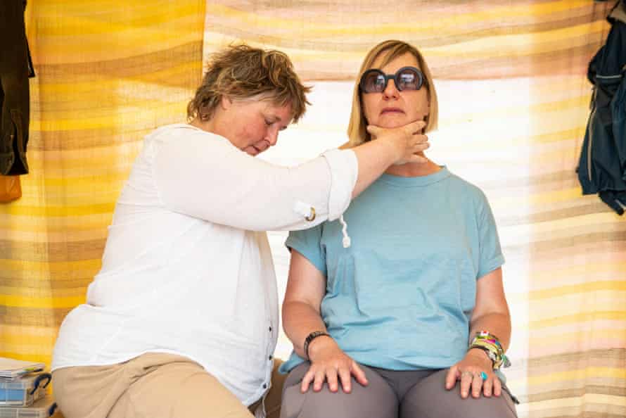 Charlotte Higgins get an Alexander technique treatment at Glastonbury from Ticca Ogilvie