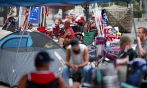 Supporters of Donald Trump line up Friday to attend the Trump campaign’s Saturday rally at the BOK Center in Tulsa, Oklahoma.
