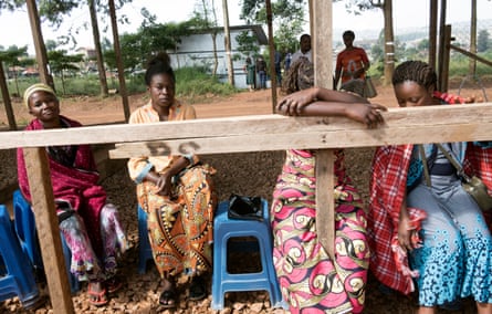 Relatives wait outside an ebola treatment centre