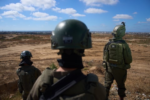 Israeli soldiers at a military position overlooking the so-called yellow line in Gaza in May. Photograph: Ariel Schalit/AP