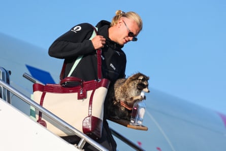 Erling Haaland carries a taxidermy raccoon