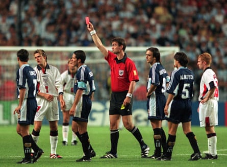 Referee Kim Milton Nielsen shows the red card to David Beckham during the second round match between Argentina v England at France 98.
