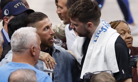 Luka Dončić talks to his friend, former Real Madrid star Sergio Ramos, after Friday’s game.