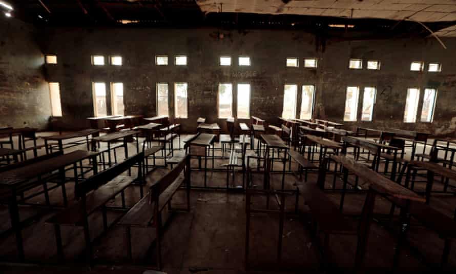 Classroom furniture is seen arranged inside the hall at the Government Science College in Kagara