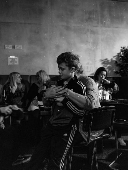 Nathan sits on his grandma’s knee at the Broadway Club.