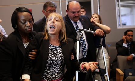 Medea Benjamin, being ejected from Obama’s talk at the National Defense University, Washington, in 2013.
