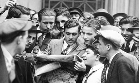 Messengers from brokerage houses crowd around a hard-to-obtain newspaper after the first Wall Street stock market crash on 24 October 1929