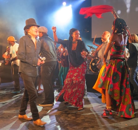 Rachid Taha, left, on stage in Marseille, France, with Fatoumata Diawara and Africa Express in 2013.