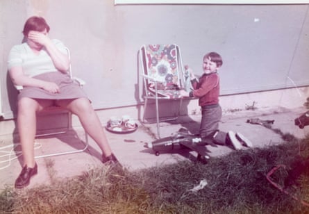 ‘I’m six or seven years old, I’d guess, and oblivious to the unhappiness that already defined my mother’s life.’ Kelman with his mother in their back garden.