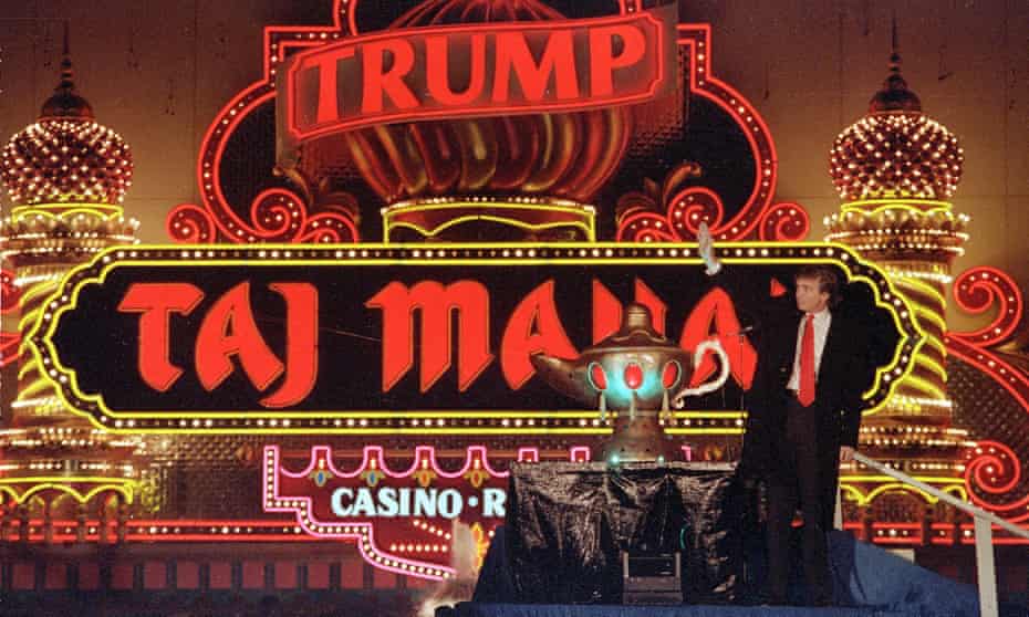  Donald Trump stands next to a genie lamp at the opening of the casino in 1990. 