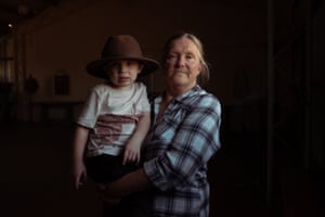 Resident Bev Smiles, 66, with her grandnephew, Will, 2, standing inside Wollar’s memorial hall, once a lively meeting place for the community in country NSW.