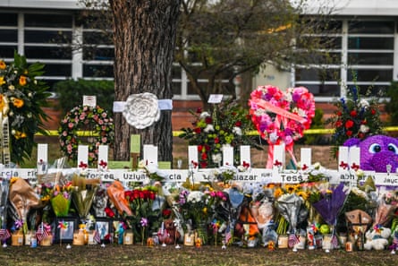 crosses, flowers and pictures at a memorial