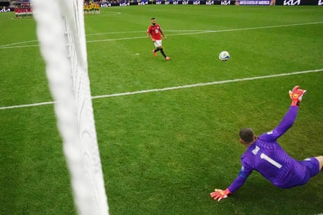 Mohamed Salah scores a penalty during Egypt's shoot-out win against Australia.