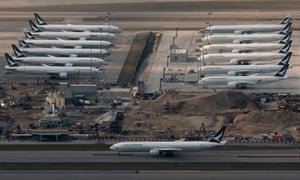 Cathay Pacific aircraft are seen parked on the tarmac at the airport, following the outbreak of the new coronavirus, in Hong Kong.