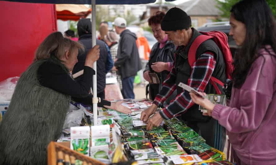 Bucha residents shop for essential items at makeshift market stalls