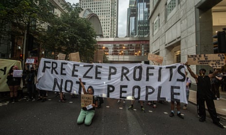 Protesters hold a sign reading ‘Freeze profits not people’ outside Ofgem’s office in London