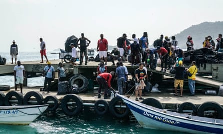 Migrants take an one-hour ferry from Necoclí to Capurganá
