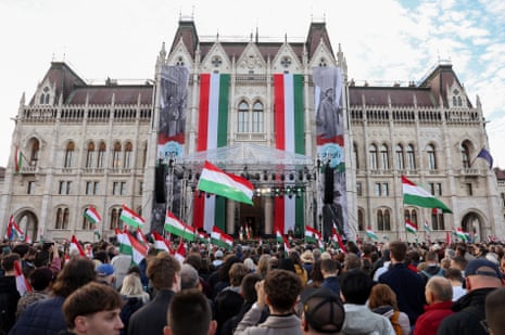 People gather in Budapest’s Kossuth Square for Péter Magyar’s speech, waving Hungarian flags.