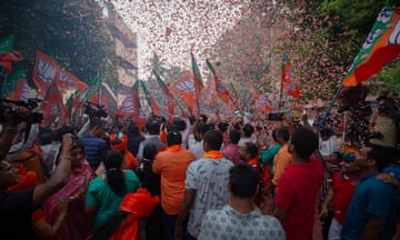 Supporters of the Bharatiya Janata Party (BJP) celebrate the election results in Bengaluru, India.