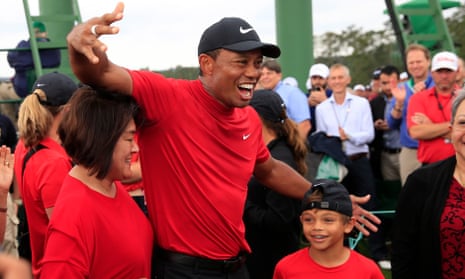 Tiger woods celebrates with his family after winning the Masters again.
