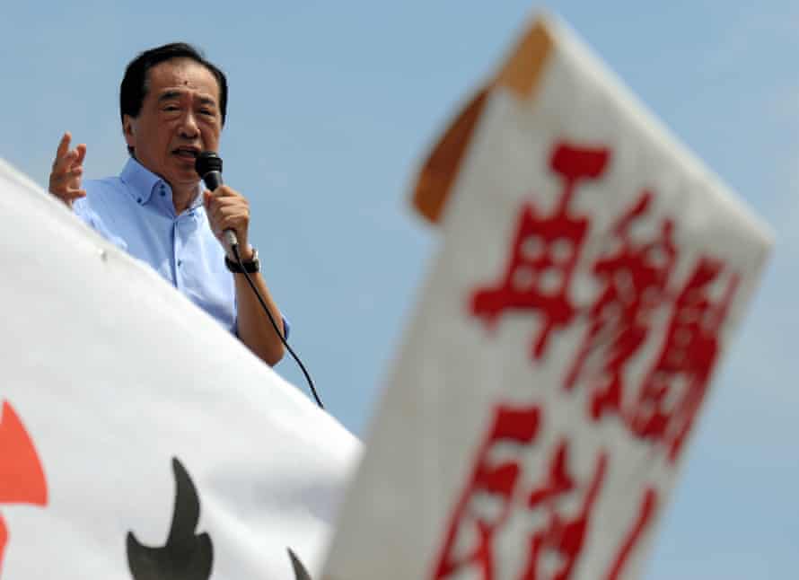 Former prime minister Naoto Kan speaks to protesters gathered at the main gate of the Sendai nuclear power plant.
