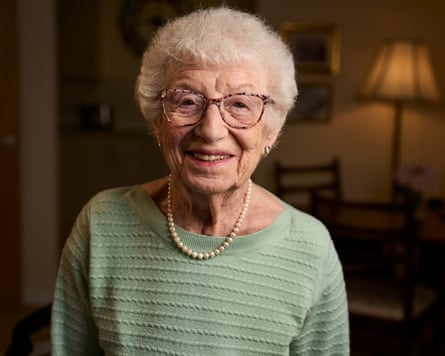 Gabriele Keenaghan smiling for the camera in her low-lit living room