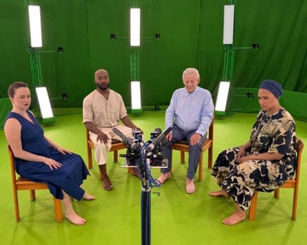 The four actors sitting in a semi-circle in a green room