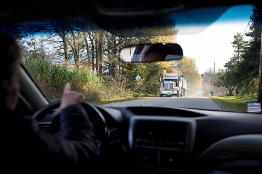 Heavy trucks leave Dufferin Aggregates' Teedon Pit quarry in Tiny, Ontario.