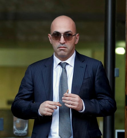 Yorgen Fenech, a bald man wearing a suit and sunglasses, leaving a Maltese court house.