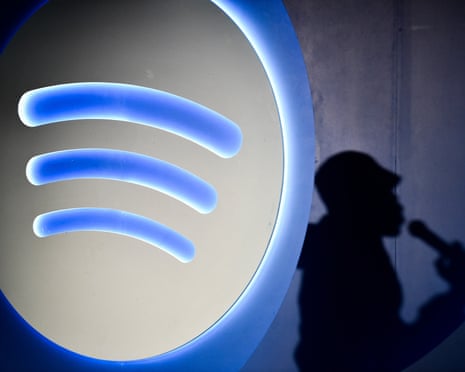 Spotify logo with silhouette of person with a microphone