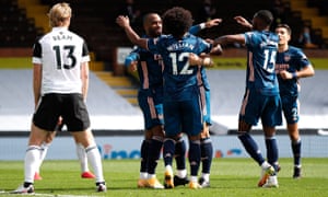 Arsenal’s Alexandre Lacazette is congratulated by his team mates after opening the scoring.