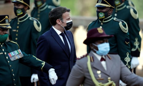France’s President Emmanuel Macron reviews the honour guard during a welcoming ceremony at the government’s Union Buildings, in Pretoria, South Africa, on 28 May.
